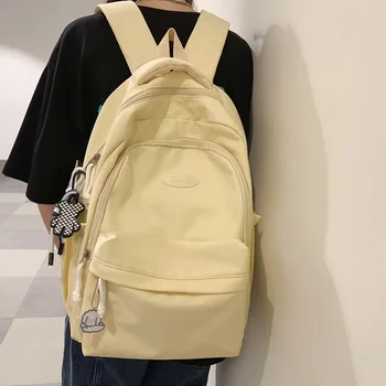 Basit omuz çantası kız öğrencilerin schoolbag kadın sırt çantası erkek büyük kapasiteli su geçirmez naylon seyahat çantası genç schoolbag Görüntü